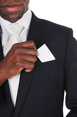 Image showing Black man putting business card in pocket