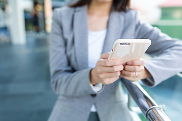 Image showing Businesswoman using mobile phone at outdoor