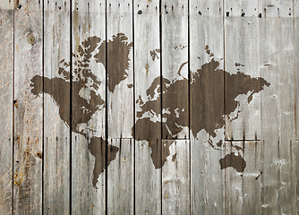 Image showing World map on a wooden wall