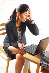 Image showing A tired woman with a notebook