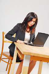 Image showing A tired woman with a notebook