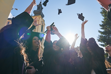 Image showing Group of diverse international graduating students celebrating