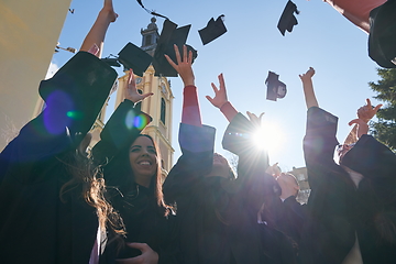 Image showing Group of diverse international graduating students celebrating