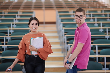 Image showing man and woman students posing in school calssroom