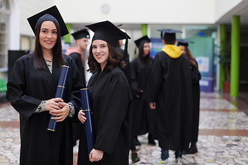 Image showing Group of diverse international graduating students celebrating