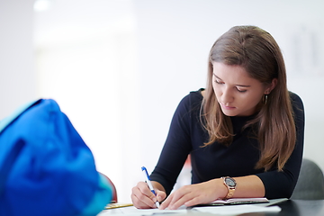 Image showing student taking notes for school class