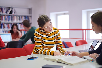 Image showing students group working on school project together on tablet computer at modern university