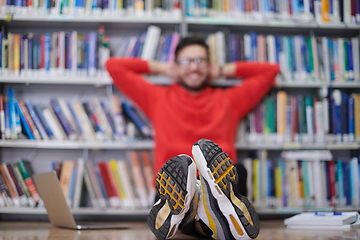 Image showing the students uses a notebook, laptop and a school library