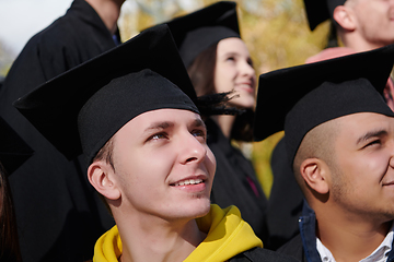 Image showing Group of diverse international graduating students celebrating