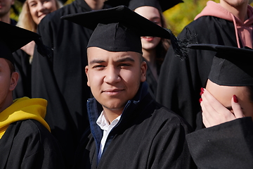 Image showing Group of diverse international graduating students celebrating