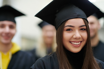 Image showing Group of diverse international graduating students celebrating