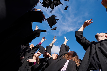 Image showing Group of diverse international graduating students celebrating