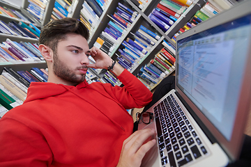 Image showing the students uses a notebook, laptop and a school library