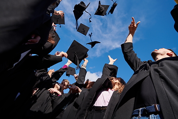 Image showing Group of diverse international graduating students celebrating