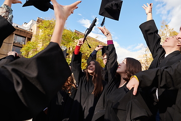 Image showing Group of diverse international graduating students celebrating