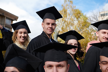 Image showing Group of diverse international graduating students celebrating