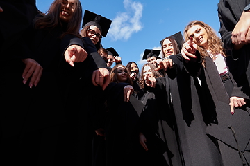 Image showing Group of diverse international graduating students celebrating