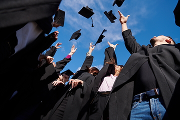 Image showing Group of diverse international graduating students celebrating