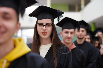 Image showing Group of diverse international graduating students celebrating