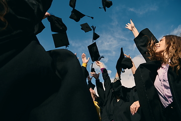 Image showing Group of diverse international graduating students celebrating