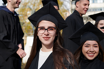 Image showing Group of diverse international graduating students celebrating