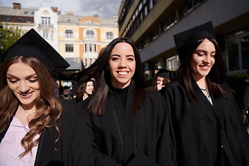 Image showing Group of diverse international graduating students celebrating