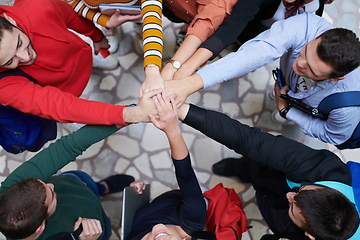 Image showing group of happy young people showing their unity.