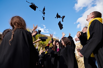 Image showing Group of diverse international graduating students celebrating