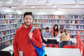 Image showing the student uses a laptop and a school library