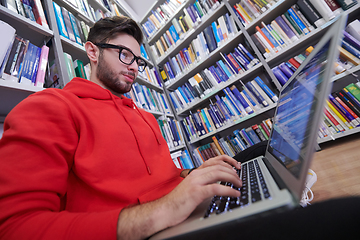 Image showing the students uses a notebook, laptop and a school library