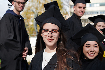 Image showing Group of diverse international graduating students celebrating