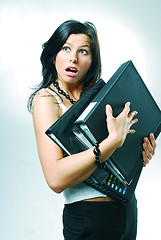 Image showing An young pretty clerk with folders