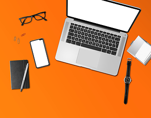 Image showing Office desk mockup top view isolated on orange