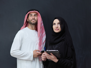 Image showing Young muslim business couple using technology devices