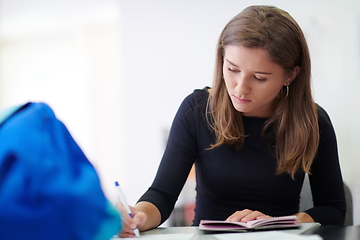 Image showing student taking notes for school class