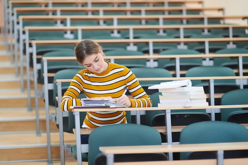 Image showing student taking notes for school class