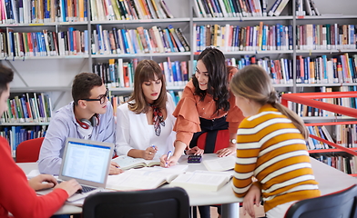 Image showing students group working on school project together on tablet computer at modern university