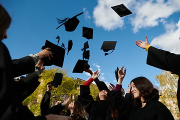 Image showing Group of diverse international graduating students celebrating