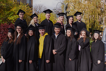 Image showing Group of diverse international graduating students celebrating