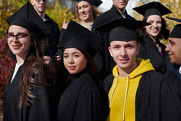 Image showing Group of diverse international graduating students celebrating