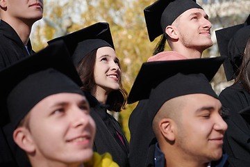 Image showing Group of diverse international graduating students celebrating