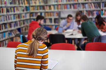 Image showing student taking notes for school class