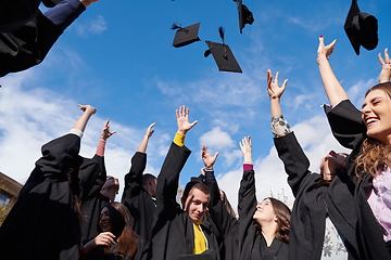 Image showing Group of diverse international graduating students celebrating