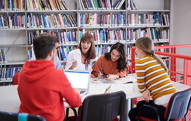 Image showing students group working on school project together on tablet computer at modern university