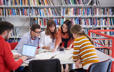 Image showing students group working on school project together on tablet computer at modern university