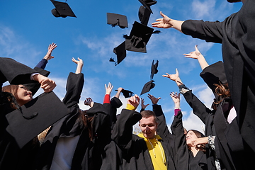 Image showing Group of diverse international graduating students celebrating