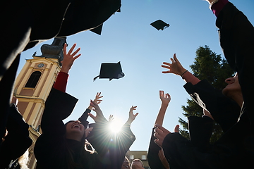 Image showing Group of diverse international graduating students celebrating