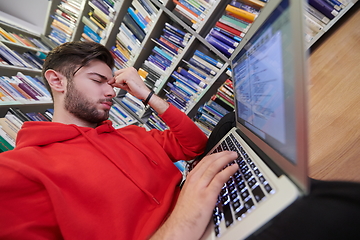 Image showing the students uses a notebook, laptop and a school library