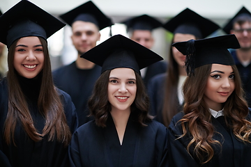 Image showing Group of diverse international graduating students celebrating