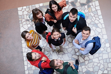 Image showing group of happy young people showing their unity.